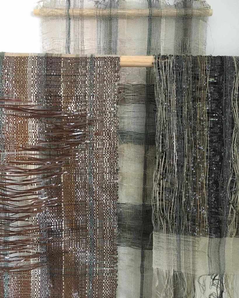 Three woven wallhangings