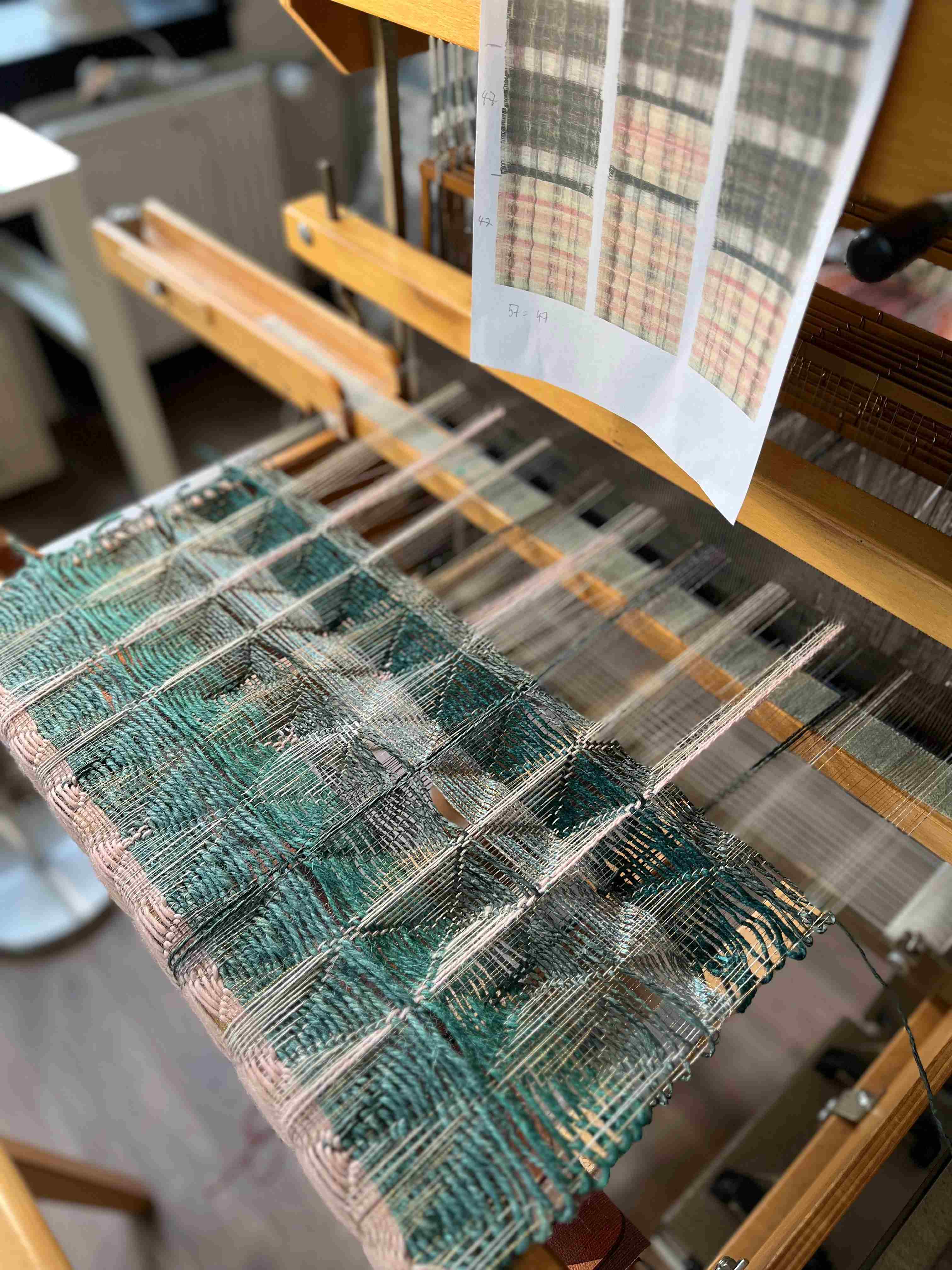Weaving of wall hanging in progress on the loom